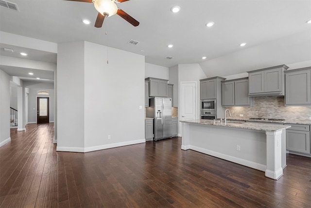 kitchen featuring appliances with stainless steel finishes, visible vents, and gray cabinetry