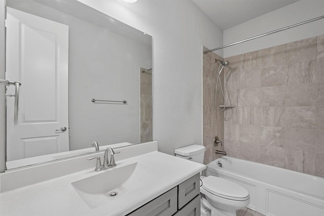 bathroom with toilet, washtub / shower combination, and vanity