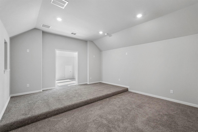 bonus room with vaulted ceiling, visible vents, and baseboards