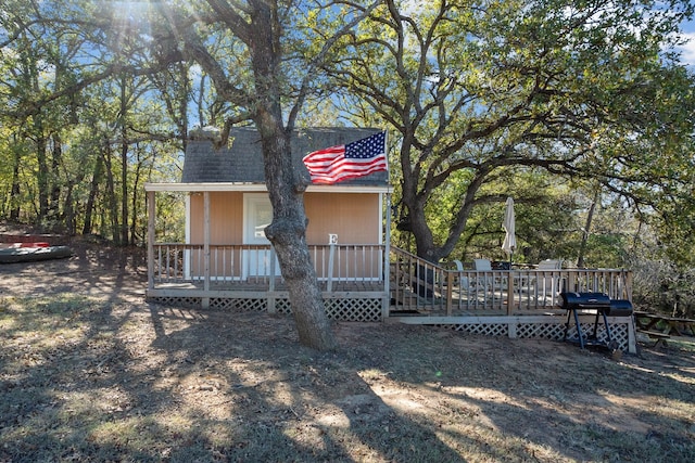 exterior space featuring a wooden deck