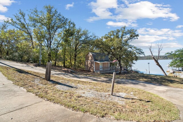 view of front of house featuring a storage unit