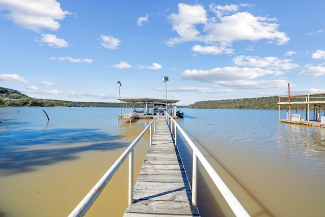 view of dock with a water view