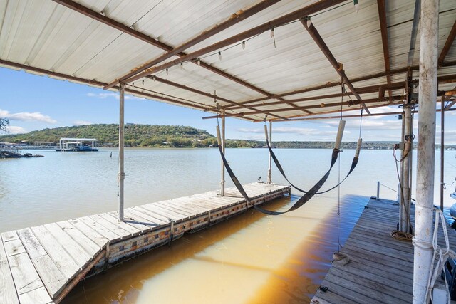 view of dock with a water view