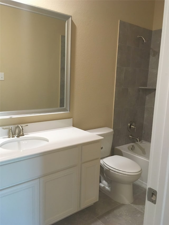 full bathroom with vanity, toilet, and tiled shower / bath