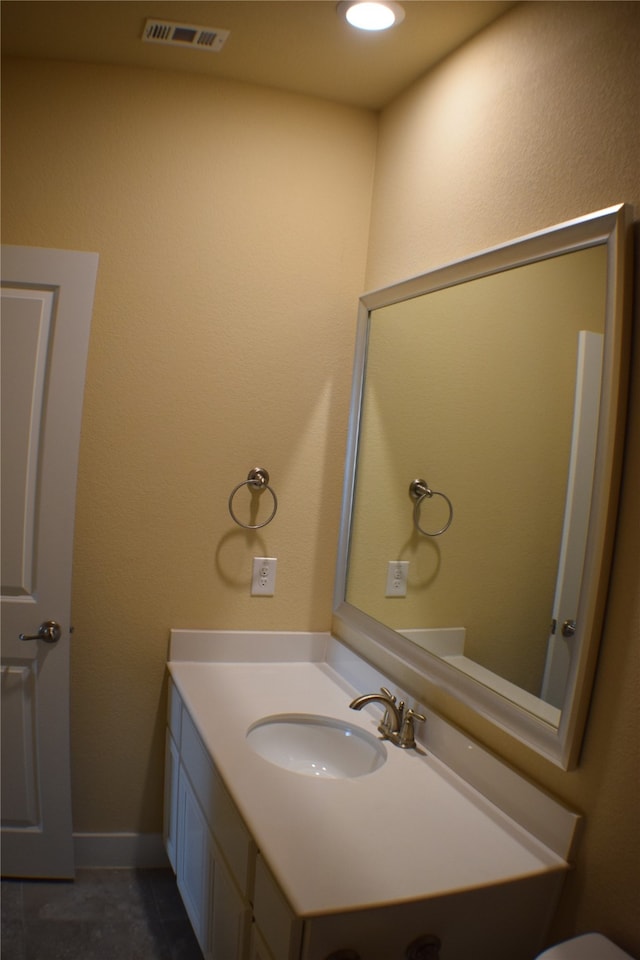 bathroom featuring tile patterned floors and vanity