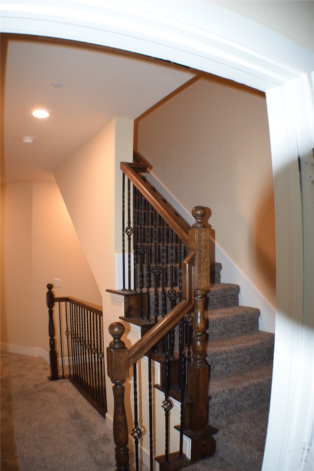 staircase with carpet floors