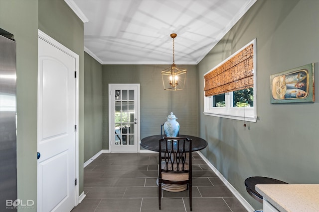 dining area with an inviting chandelier and crown molding