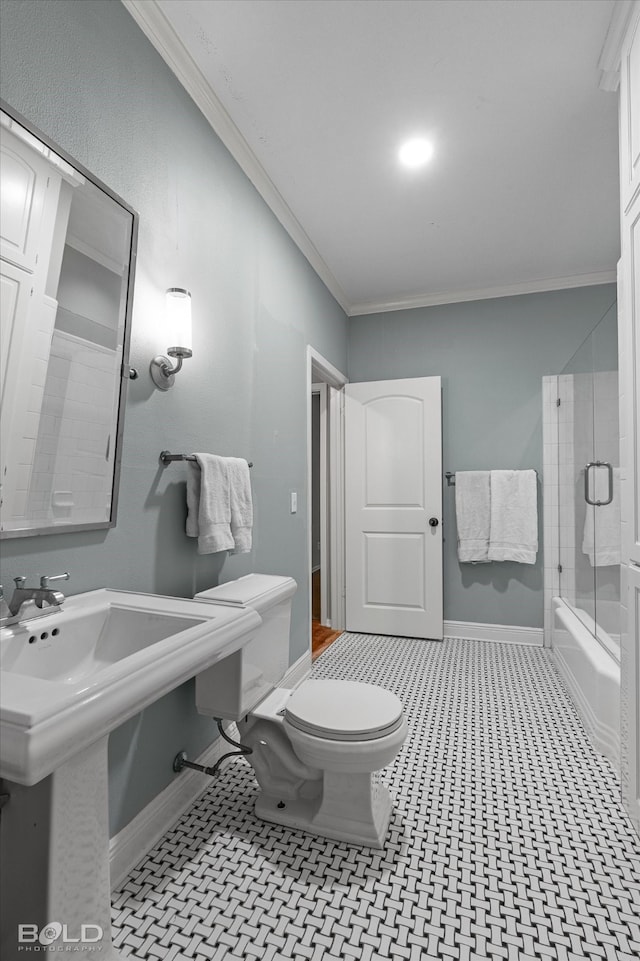 full bathroom with sink, toilet, ornamental molding, and enclosed tub / shower combo