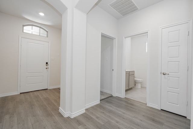 foyer entrance with light hardwood / wood-style flooring