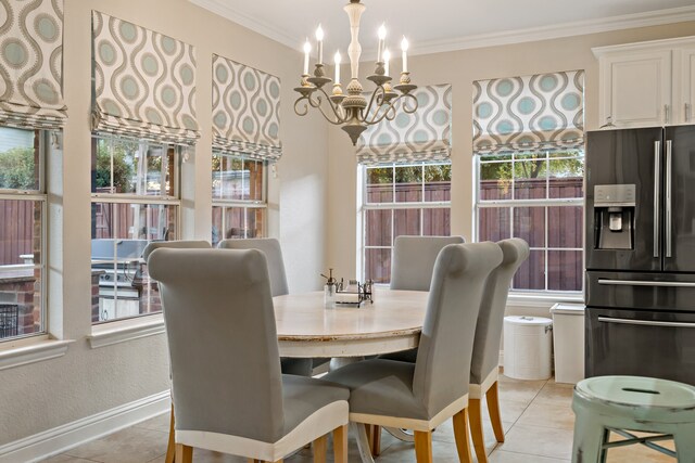 dining space with ornamental molding, light tile patterned floors, and a healthy amount of sunlight