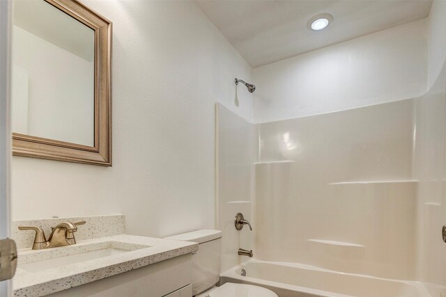 full bathroom featuring vanity, toilet, and bathing tub / shower combination