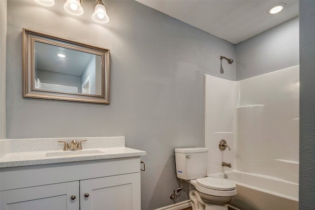 full bathroom with vanity, toilet, and washtub / shower combination