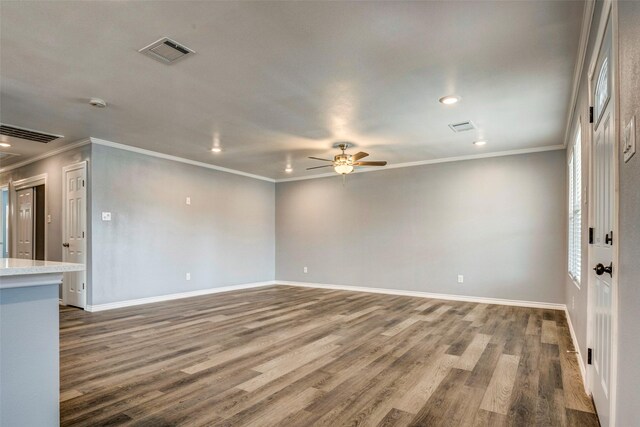 unfurnished living room featuring ceiling fan, hardwood / wood-style floors, and ornamental molding