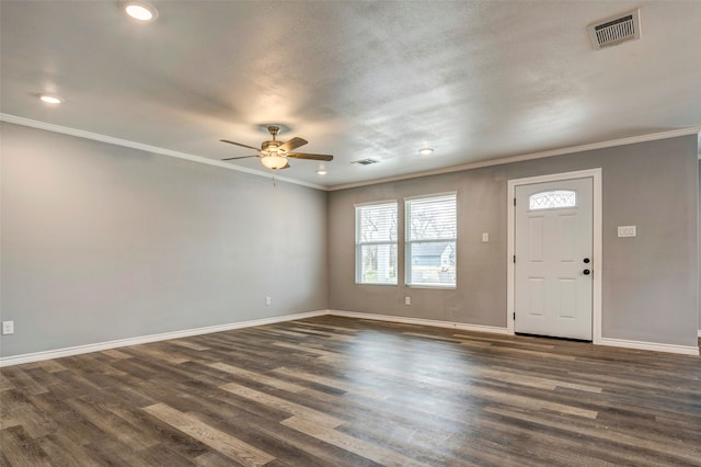 entrance foyer featuring a textured ceiling, dark hardwood / wood-style flooring, ceiling fan, and crown molding