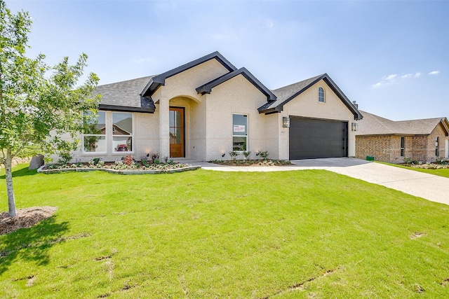 view of front facade featuring a front yard and a garage