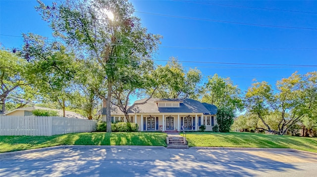 view of front of property featuring a front lawn and a porch