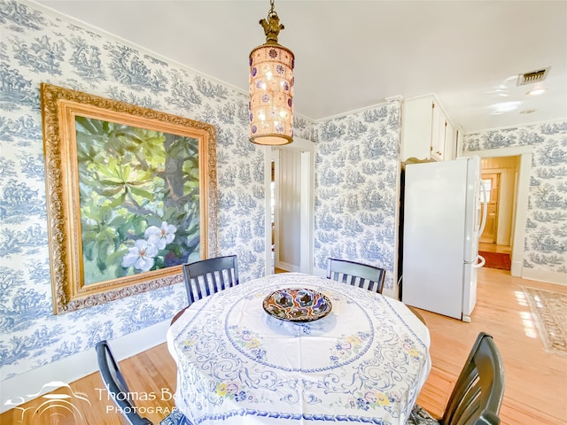 dining space featuring light hardwood / wood-style floors