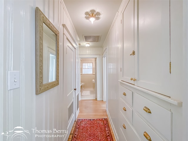 hallway with light wood-type flooring