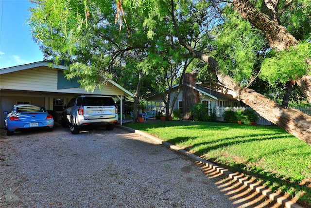 ranch-style house with a front lawn and a carport