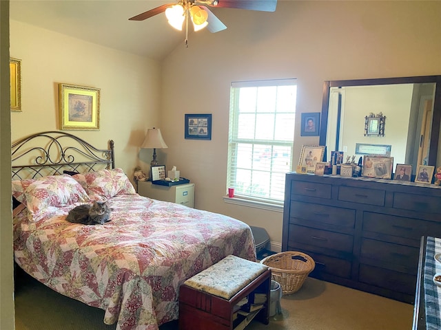 bedroom featuring carpet, vaulted ceiling, multiple windows, and ceiling fan