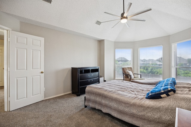 bedroom featuring multiple windows, ceiling fan, and carpet floors