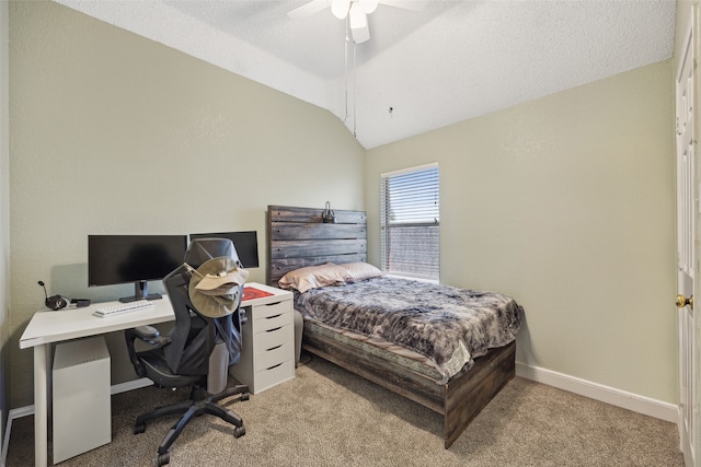 carpeted bedroom with a textured ceiling, vaulted ceiling, and ceiling fan