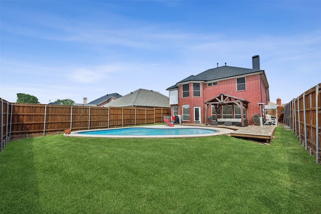 view of swimming pool featuring a gazebo, a deck, and a lawn