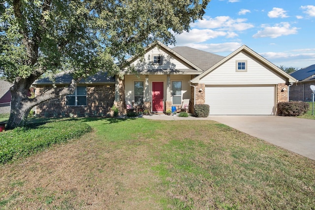 view of front of home featuring a front lawn and a garage