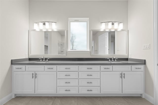 3208 Andesite Rd, Mckinney, TX 75071 - full bathroom with baseboards, double vanity, and marble finish flooring
