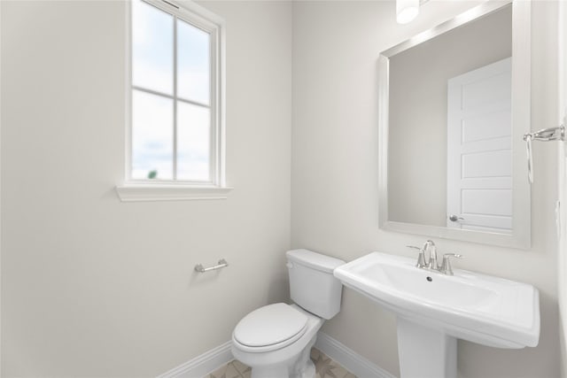 3208 Andesite Rd, Mckinney, TX 75071 - half bath featuring baseboards, toilet, and a sink
