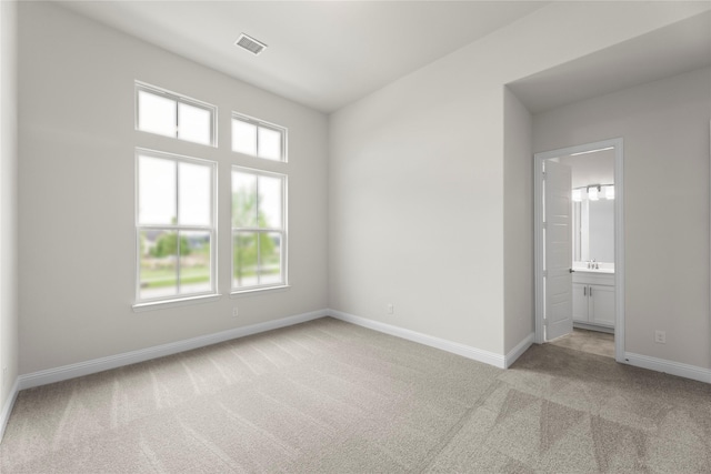 3208 Andesite Rd, Mckinney, TX 75071 - unfurnished bedroom featuring light colored carpet, multiple windows, and baseboards