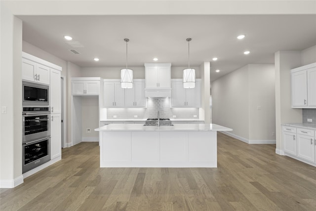 3208 Andesite Rd, Mckinney, TX 75071 - kitchen with appliances with stainless steel finishes, baseboards, decorative backsplash, white cabinetry, and recessed lighting
