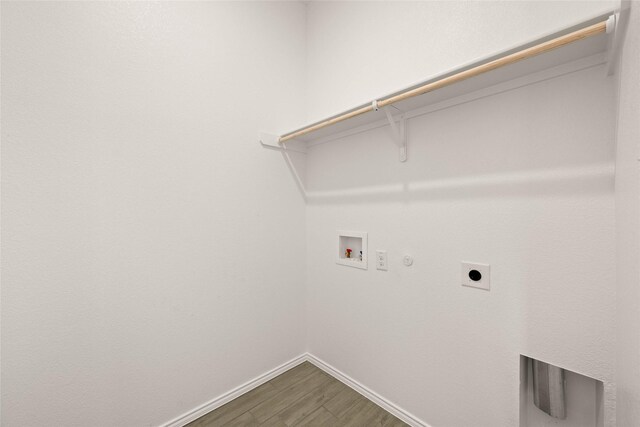 laundry room with gas dryer hookup, hardwood / wood-style floors, hookup for a washing machine, and hookup for an electric dryer