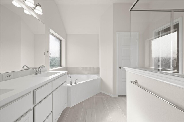 bathroom with tile patterned flooring, an inviting chandelier, vanity, a tub to relax in, and vaulted ceiling