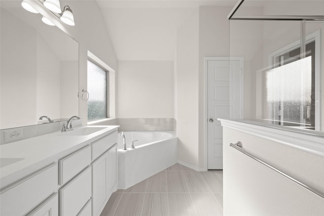 bathroom with lofted ceiling, tile patterned floors, a tub, vanity, and a notable chandelier