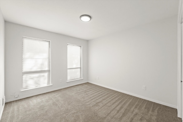 unfurnished room featuring carpet floors