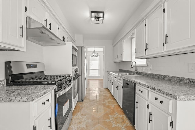 kitchen with white cabinets, sink, light tile patterned floors, and stainless steel appliances