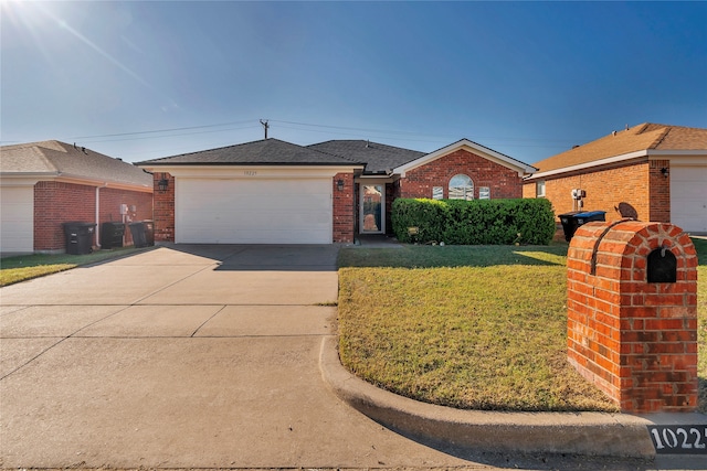 single story home with a front yard and a garage