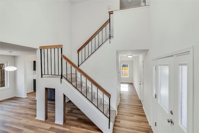 stairway with hardwood / wood-style flooring