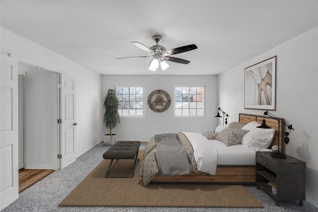 carpeted bedroom with ceiling fan