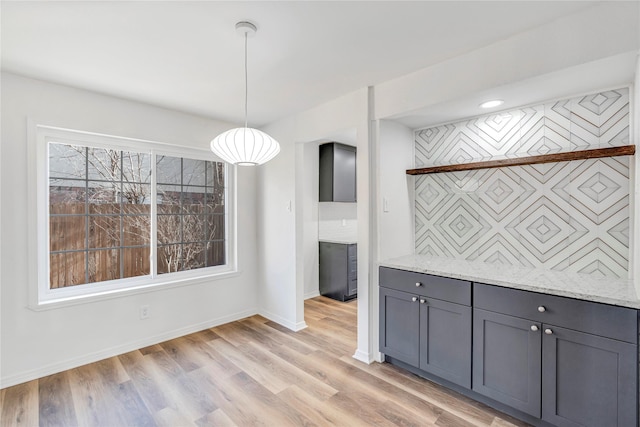 unfurnished dining area featuring light hardwood / wood-style floors