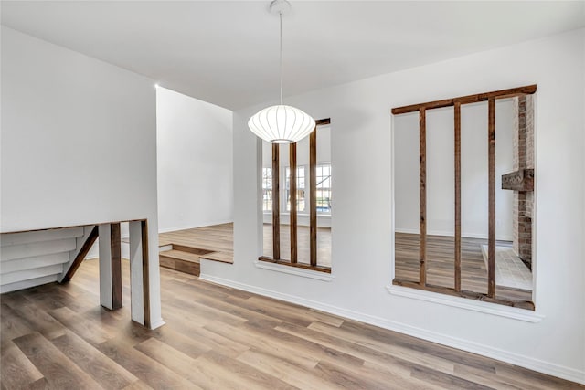 unfurnished dining area with hardwood / wood-style floors