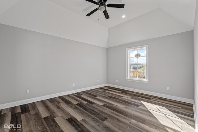 empty room featuring ceiling fan, dark wood-type flooring, and vaulted ceiling