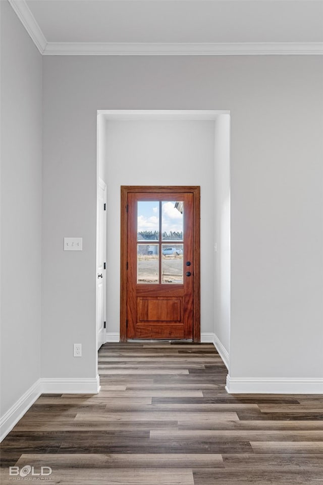 foyer entrance with dark hardwood / wood-style flooring and crown molding