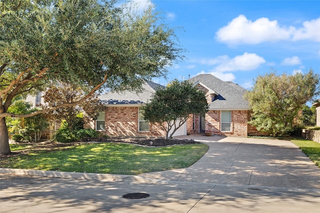 view of property hidden behind natural elements with a front yard