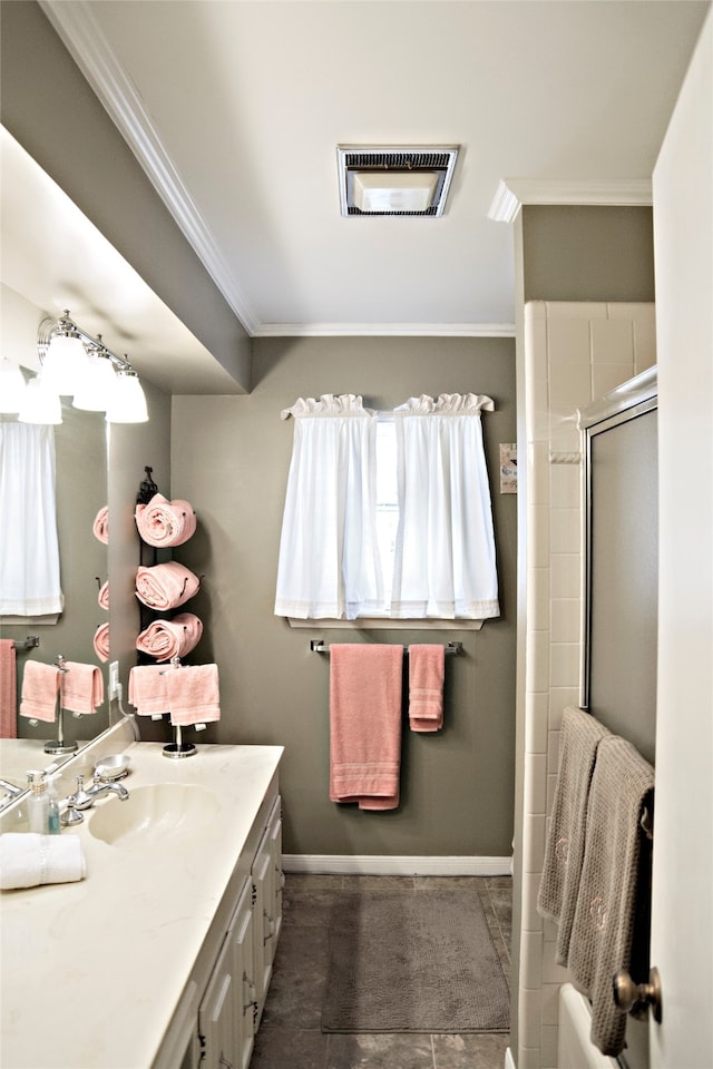 bathroom with vanity and ornamental molding