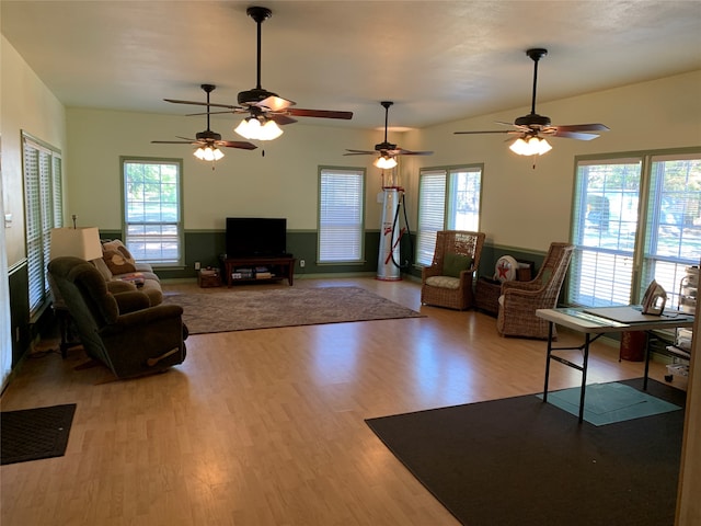 living room with light wood-type flooring and ceiling fan