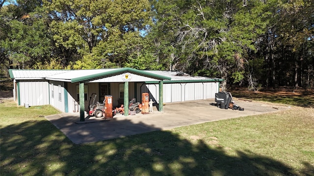 view of outdoor structure with a lawn