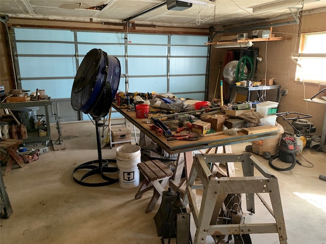 garage featuring a workshop area and a garage door opener