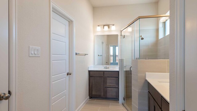 bathroom with vanity and a stall shower